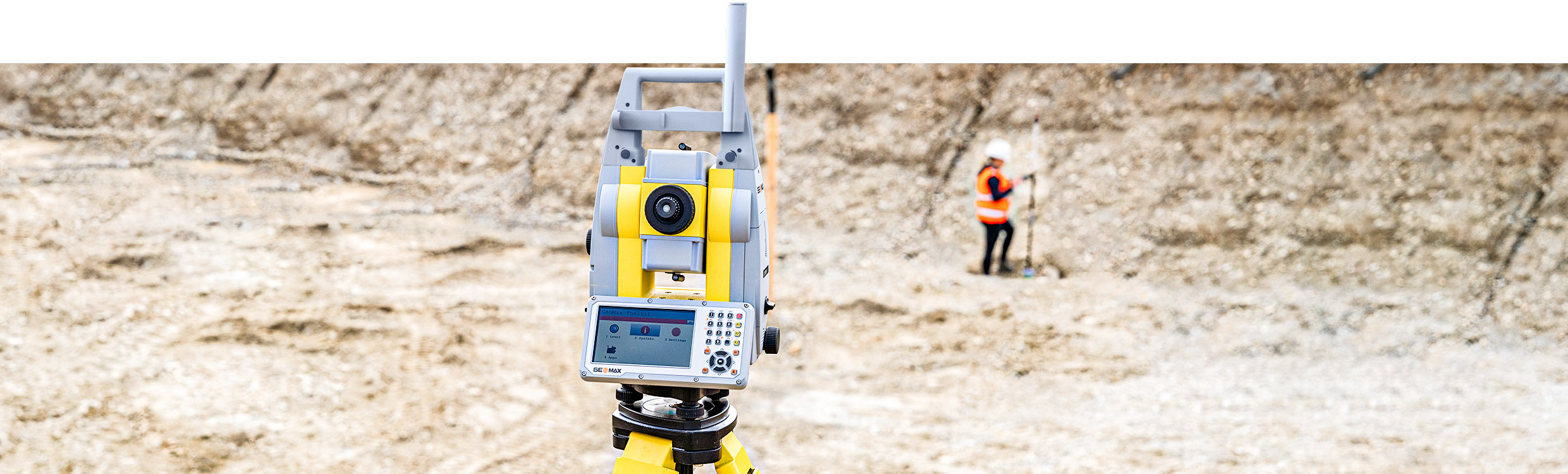 Geomax Zoom95 robotic total station on a tripod out in the field